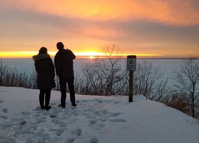 Couple overlooking lake 