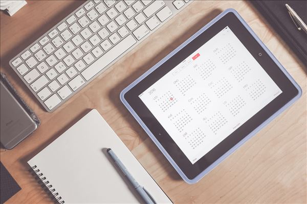 View Calendar A tablet displays a calendar on a desk