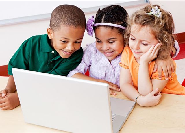 learn about the SWMPC's involvement in broadband initiatives children with broadband access on laptop